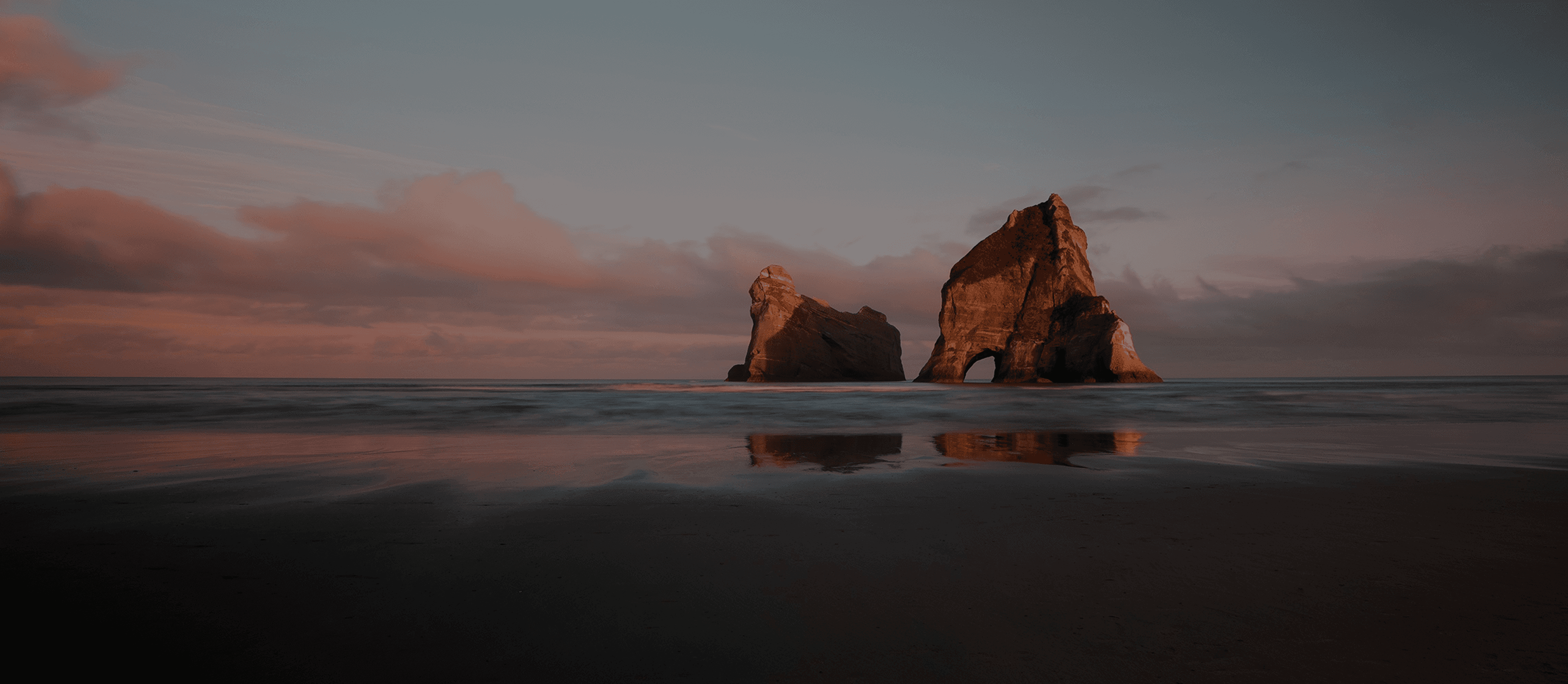 Rocky Mediterranean coastline at sunset